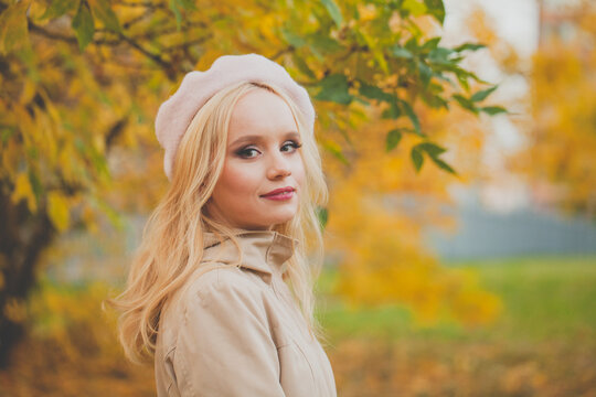 Autumn Mood. Happy Young Woman On Yellow Nature Background