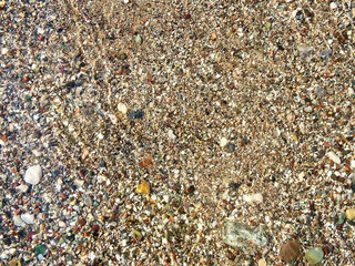 Pebbles on the beach in water