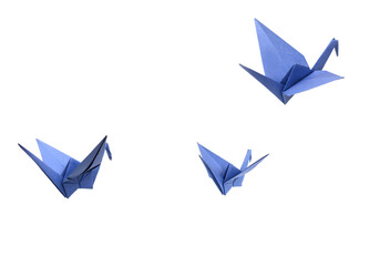 Folding birds Paper, origami crans flying on white