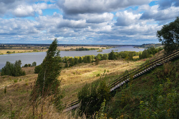 Oka river under blue sky on sunny autumn day.