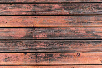 Horizontal old red-brown wooden board wall