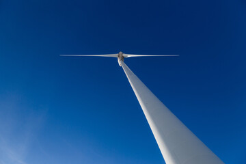 Huge wind turbine with blue sky