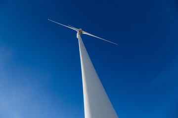 Huge wind turbine with blue sky