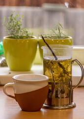 still life with a kettle and a cup of tea, relaxation, autumn