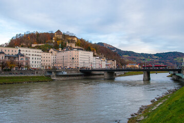 Obraz premium Embankment of Salzach river in Salzburg town, Austria