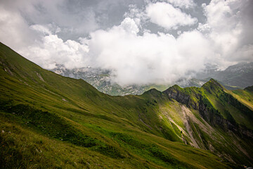 Obraz premium Alpine mountain Diethelm above the valley and alpine Lake Wagitalersee Waegitalersee , Innerthal - Canton of Schwyz, Switzerland Kanton Schwyz, Schweiz