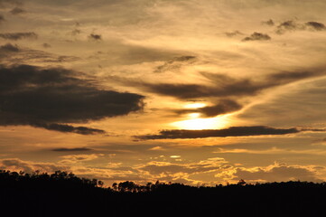 Beautiful scenery and sky with golden yellow white clouds and mountains before sunrise The sunrise from the top of the mountain