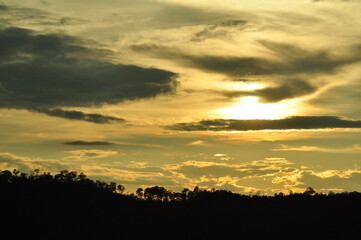 Sunset view with beautiful golden sky,the colorful sky lights in the evening