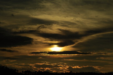 Sunset view with beautiful golden sky,the colorful sky lights in the evening