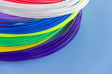 Kit colored PLA and ABS plastic filament for 3D printer and pen. Hobby for children. Close-up. .