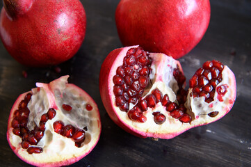 Ripe red pomegranates. Seasonal fruits. Royal fruit. Macro photo pomegranates.