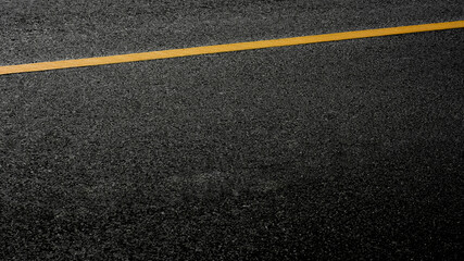 yellow line on black asphalt road.