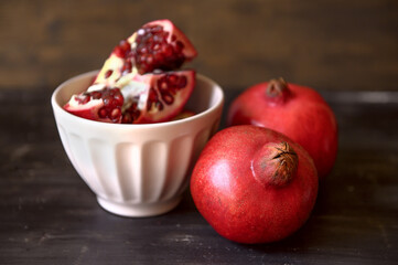 Ripe red pomegranates. Seasonal fruits. Royal fruit.