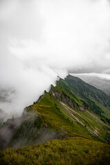 mountain peak in the clouds. top of mountains. Swiss alps