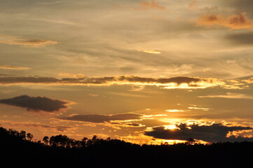 Sunset view with beautiful golden sky,the colorful sky lights in the evening	