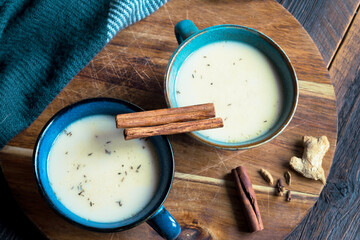 two cups of  indian masala tea with spices close up