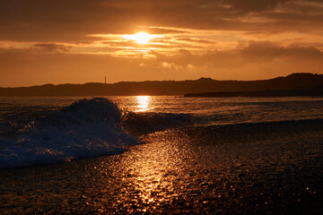 sunset on the beach. Denmark with big wave. Klitmoller (Cold Hawaii).