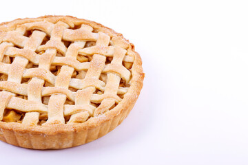 Traditional American Thanks Giving lattice pie isolated on white background. Homemade fruit tart baked to golden crust. Close up, copy space, top view.