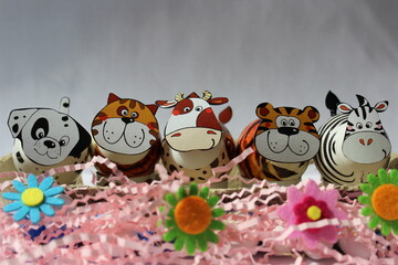Easter background with easter eggs as animals with spring decoration