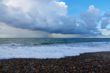 White rain cloud over the east sea on the beach of denmark, klitmoller (cold hawaii)