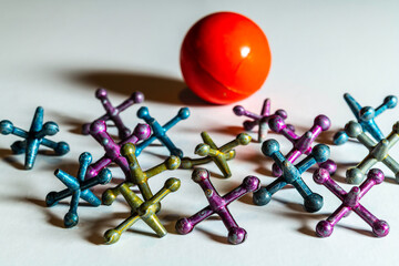 vintage metal jacks isolated on white with red rubber ball