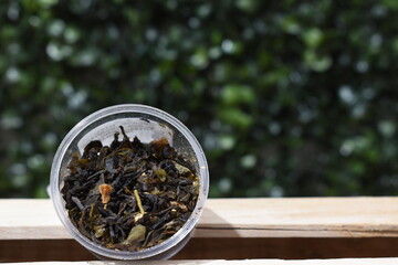 macro view of different teas on a green background