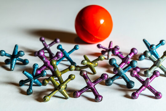 vintage metal jacks isolated on white with red rubber ball