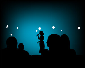 Spectators in nightclub in front of the screen. Silhouettes of people