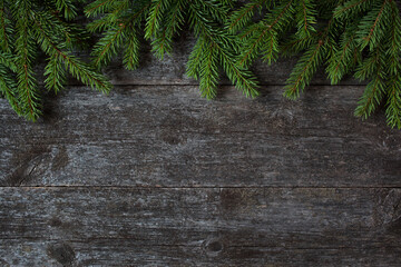 Christmas wooden old background and fir branches, space for text.