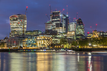 Fototapeta na wymiar London business district at night by the Thames