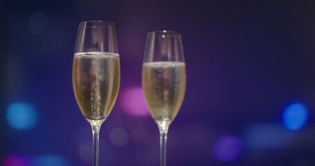 Glass of the Champagne over the city night view