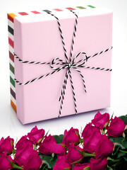 Colorful gift box with flowers.
Birthday theme in pastel colors.