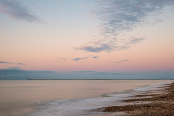 Naklejka na ściany i meble Stunning colorful sunrise over beach landscape on English South coast
