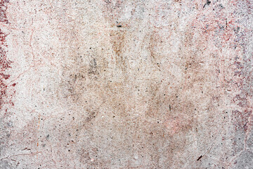 Texture of a concrete wall with cracks and scratches which can be used as a background