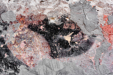 Texture of a concrete wall with cracks and scratches which can be used as a background