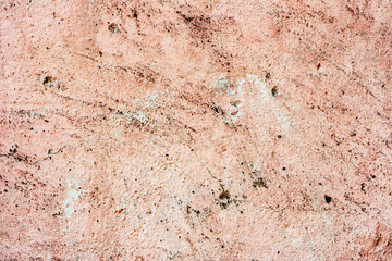 Texture of a concrete wall with cracks and scratches which can be used as a background