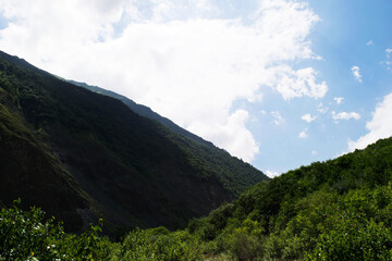Fototapeta premium View of the mountains of the North Caucasus. Mountains in the clouds in summer