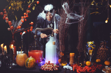 Halloween elf with magic magic in the dark forest.