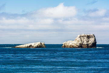 Stark white rocks jut out of the Pacific Ocean