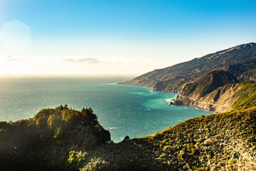 Backlit trees on a curving ridge on the coast of Big Sur © Brian Swanson