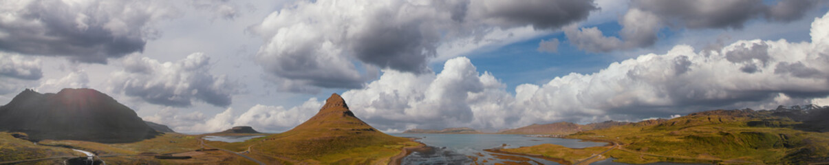 Sunset sky colors over Kirkjufell Mountain, panoramic aerial view
