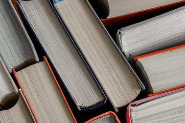 stack of colorful books in a library