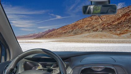 Car windshield with view of Badwater Basin, Death Valley, USA