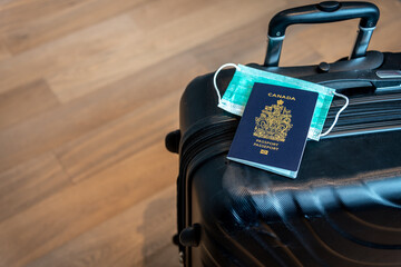 Canadian passport with covid-19 masks with travel theme.  © Jeff Whyte