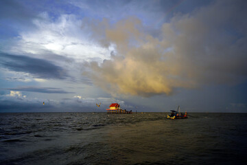 fishing house at the middle of the sea