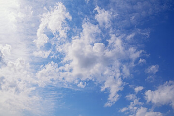 Light white clouds in blue sky on sunny day