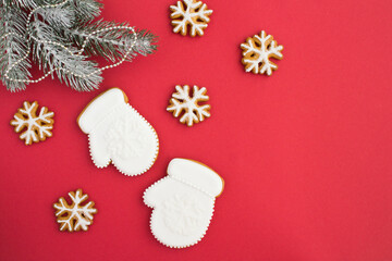 Christmas composition with gingerbread on the red background with copy space