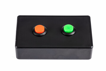 A Red and Green Button on a Black Plastic Box Isolated on White