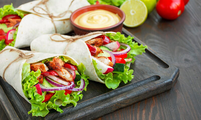 Wrapped Burrito Chicken Vegetables Close Wooden Background Mexican Cuisine Copy space.