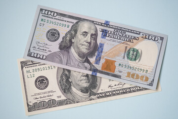  Hundred dollar bills close up on blue background. 100 US dollars banknotes